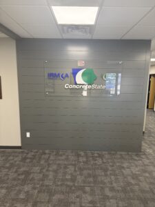 Custom commercial interior finish with feature wall and acrylic logo signage