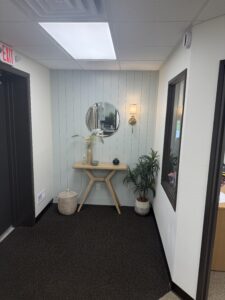 Office entry hallway with trim accent wall