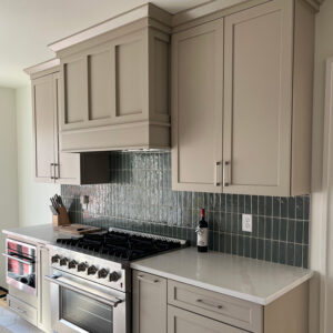 Modern kitchen remodeling project with custom range hood