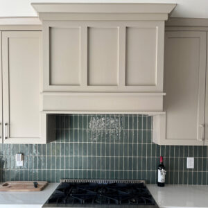 Modern kitchen remodeling project with custom range hood