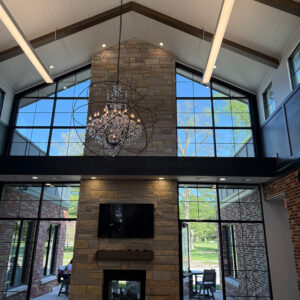 Commercial building interior with exposed beams and large windows