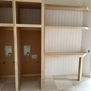 Built-in storage and floating shelves under construction