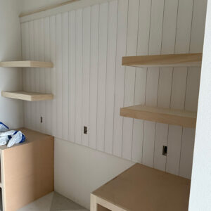 Built-in storage and floating shelves under construction