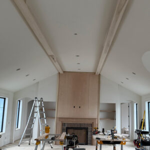 Hand trimmed ceiling beams in living room